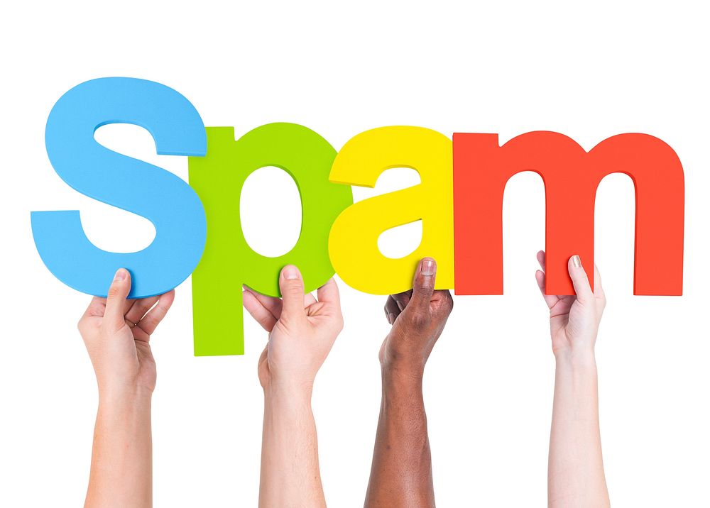 Diverse Hands Holding the Word Spam