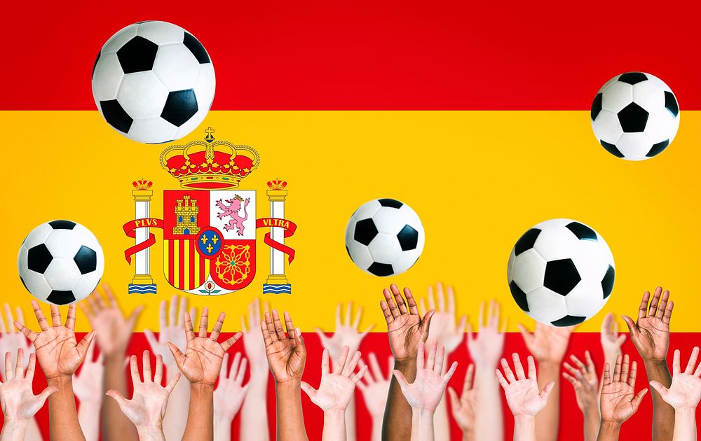 Raised Arms and Spanish Flag as a Background for World Cup