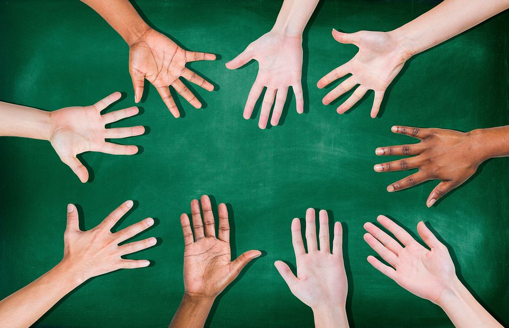 Group of Diverse Multiethnic Hands on a Blackboard