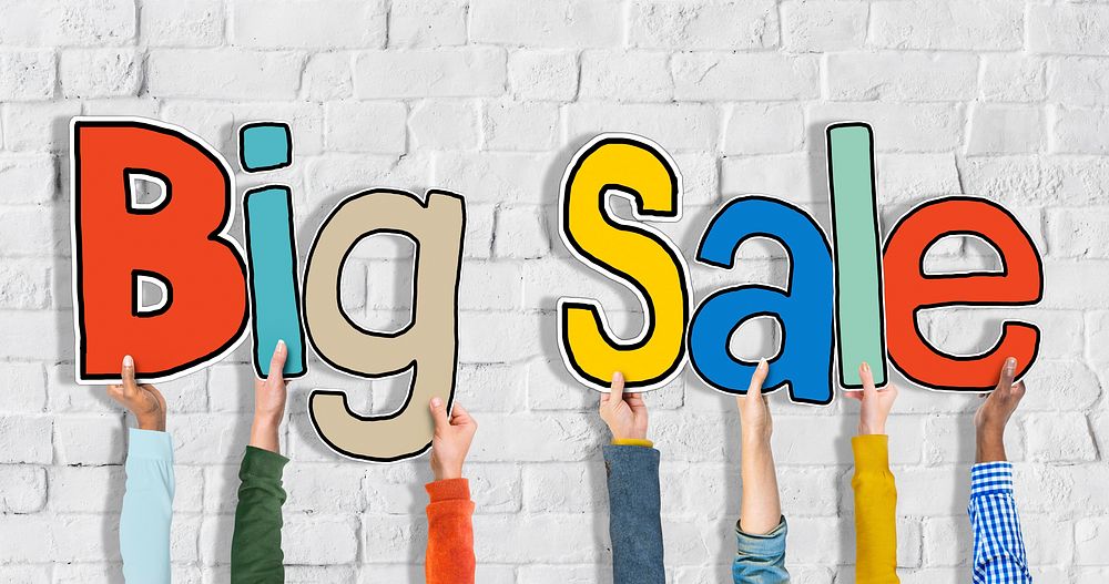 Group of Hands Holding Word Big Sale