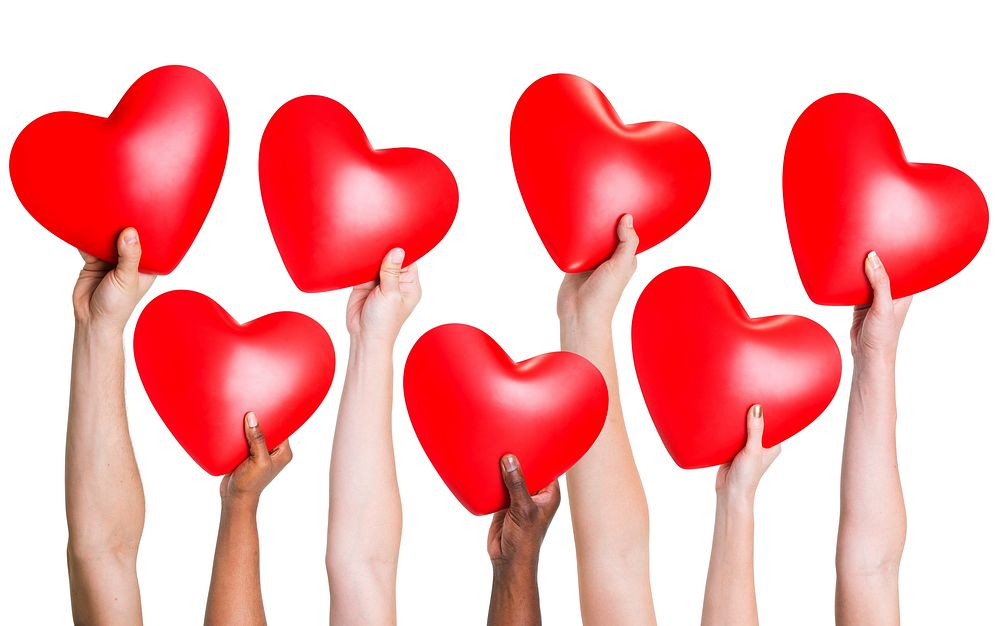 Multi-ethnic group of people's hand holding heart