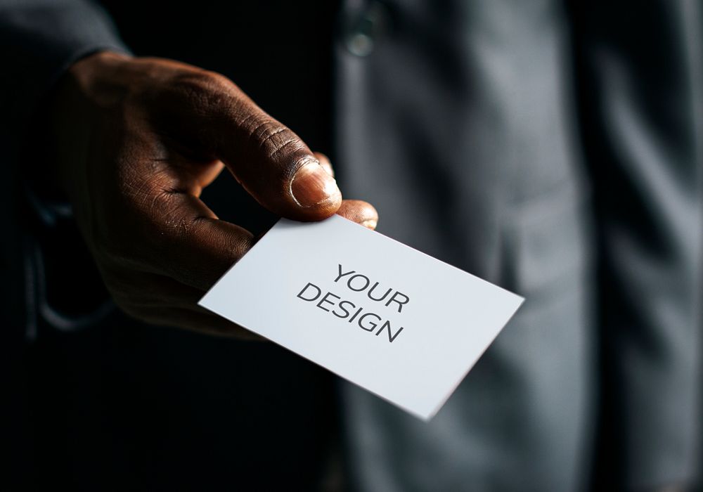 Person handing over a business card