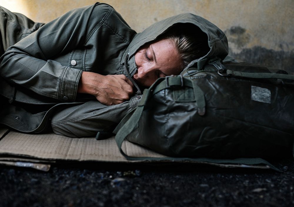 Homeless woman sleeping on the street