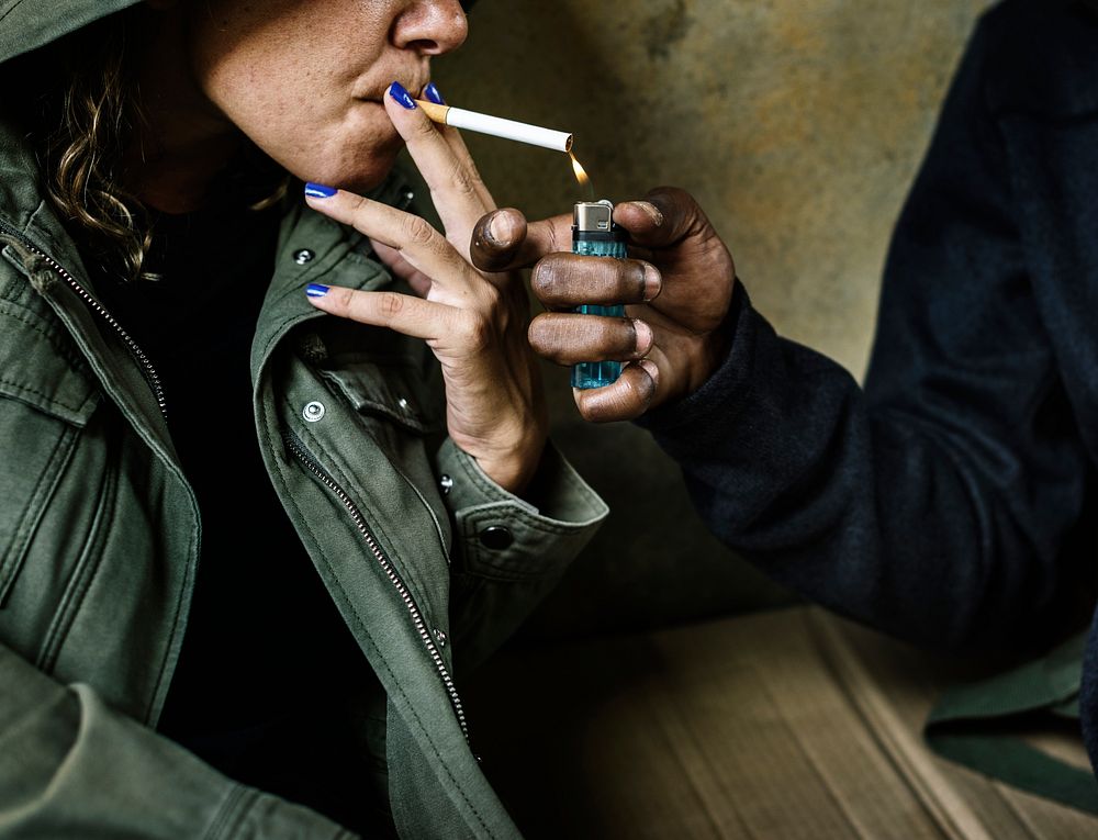 Woman getting her cigarette lit