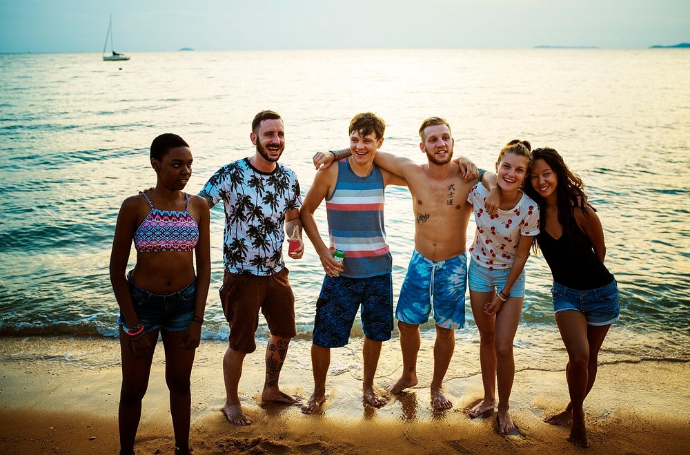 Group of diverse friends at the beach together