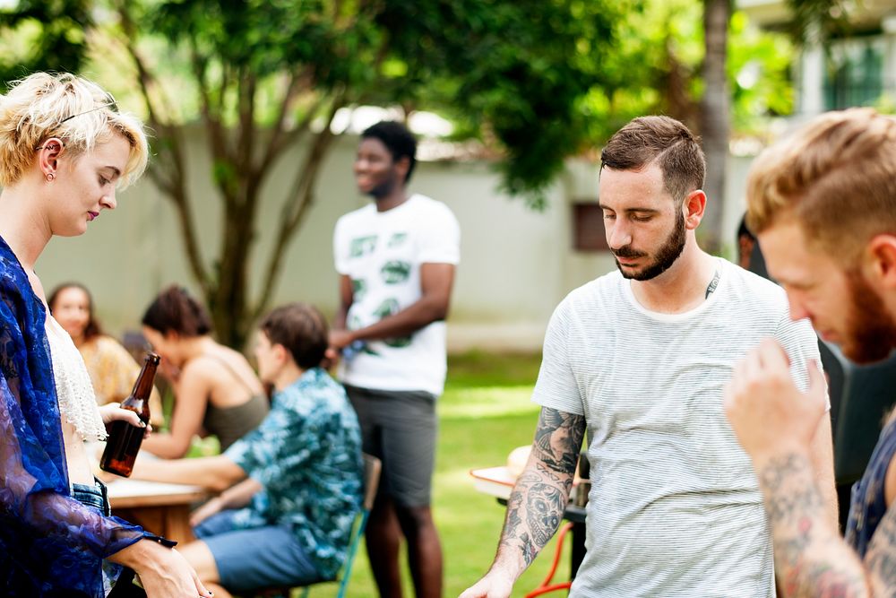 Group of diverse friends cooking barbecue together