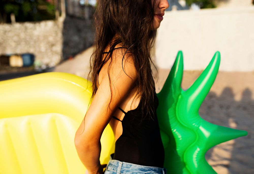 Closeup of an Asian woman with inflatable float at the beach