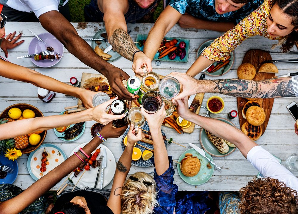 Aerial view of a diverse group of friends toasting together