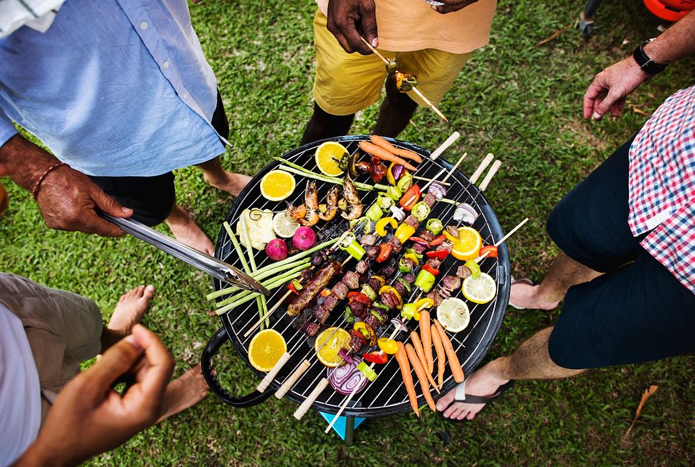 Diverse people enjoying barbecue party together