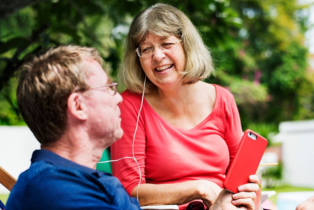 Caucasian couple listening to music together