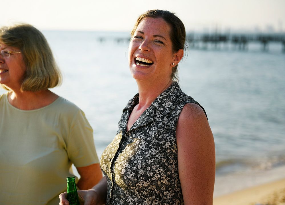 Closeup of caucasian woman standing by the beach