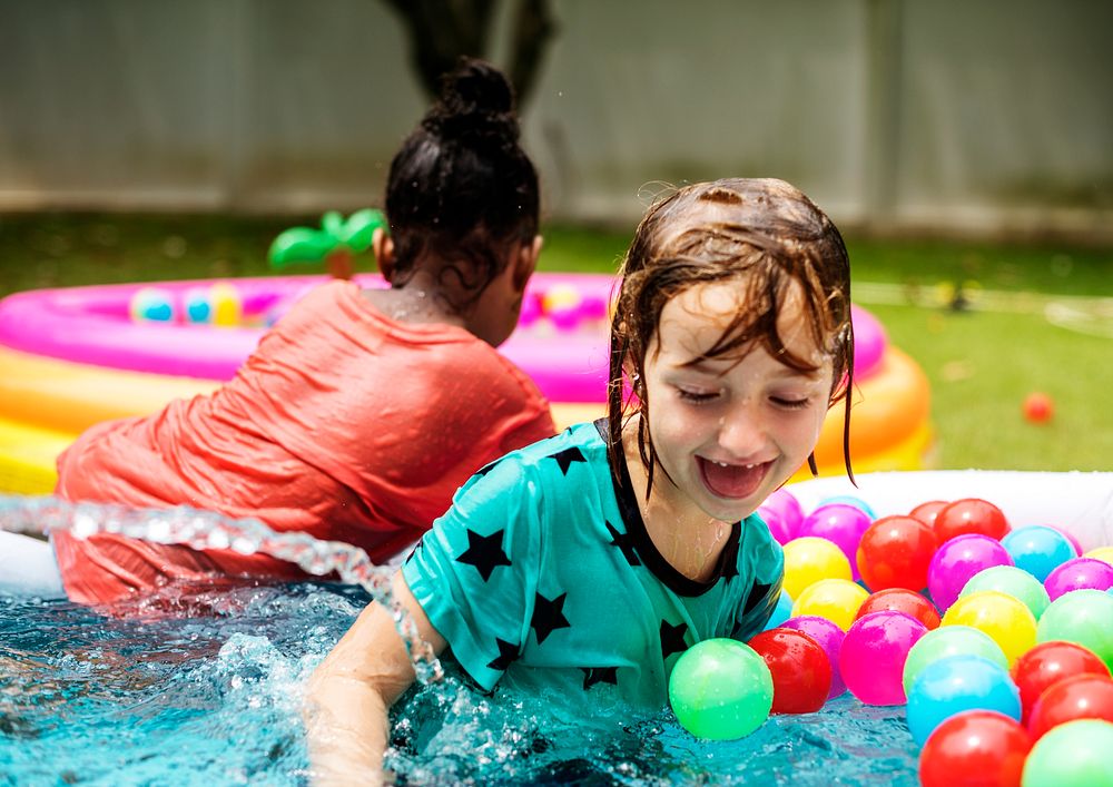 Kid playing in a rubber pool