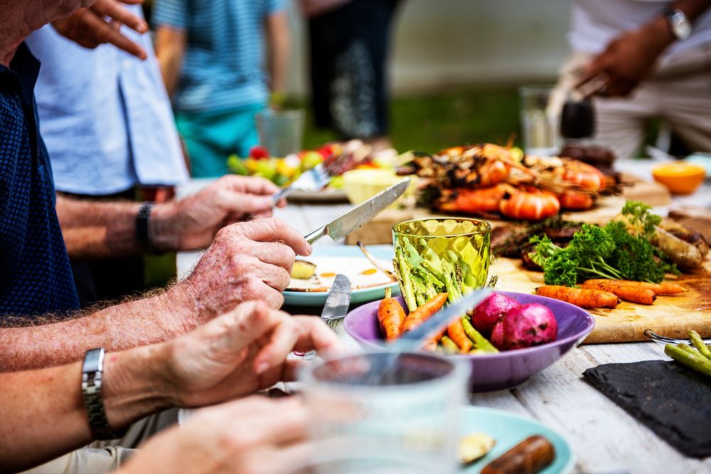 Closeup of diverse people enjoying barbecue party together
