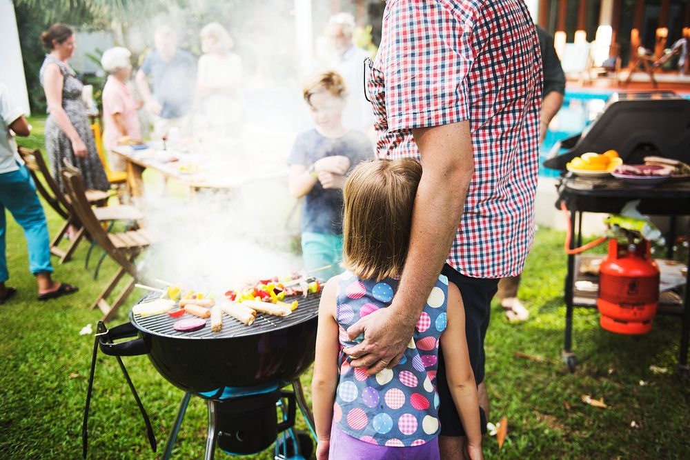 Diverse people enjoying barbecue party together