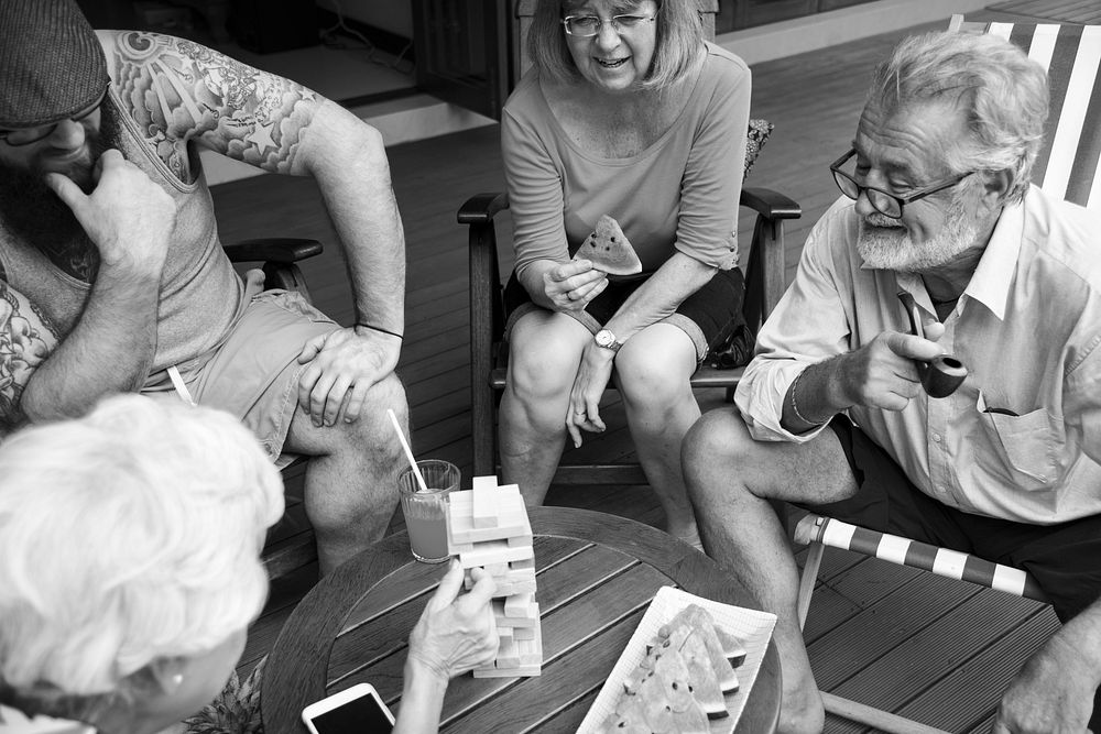Diverse senior adult people playing wooden game