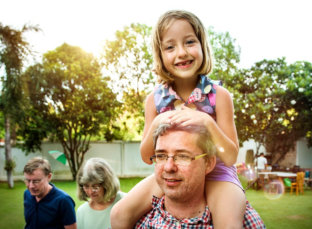 Caucasian family enjoying summer together at backyard