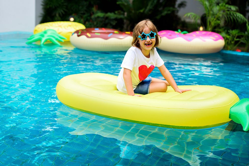 Caucasian girl relaxing in a pool