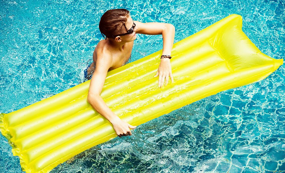 Young caucasian boy enjoying the pool