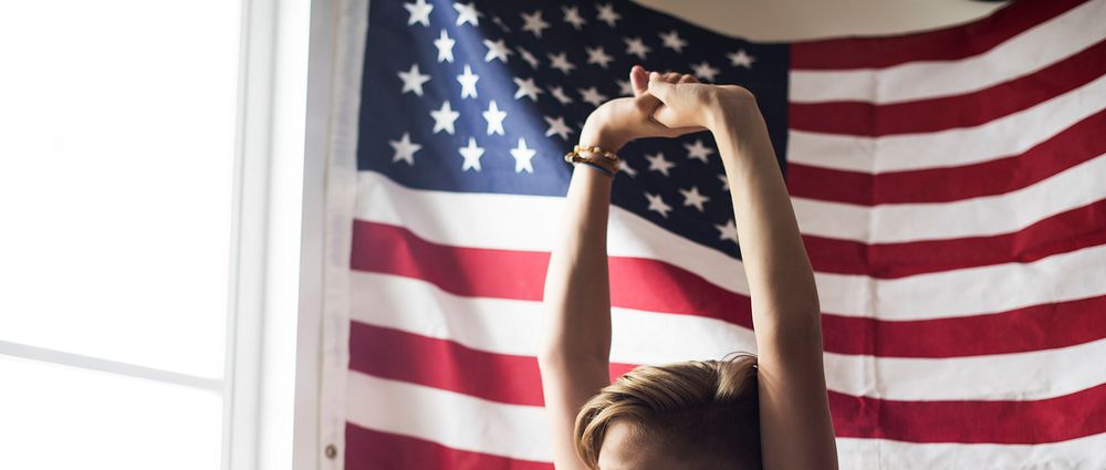 Closeup of stretching arms with american flag background