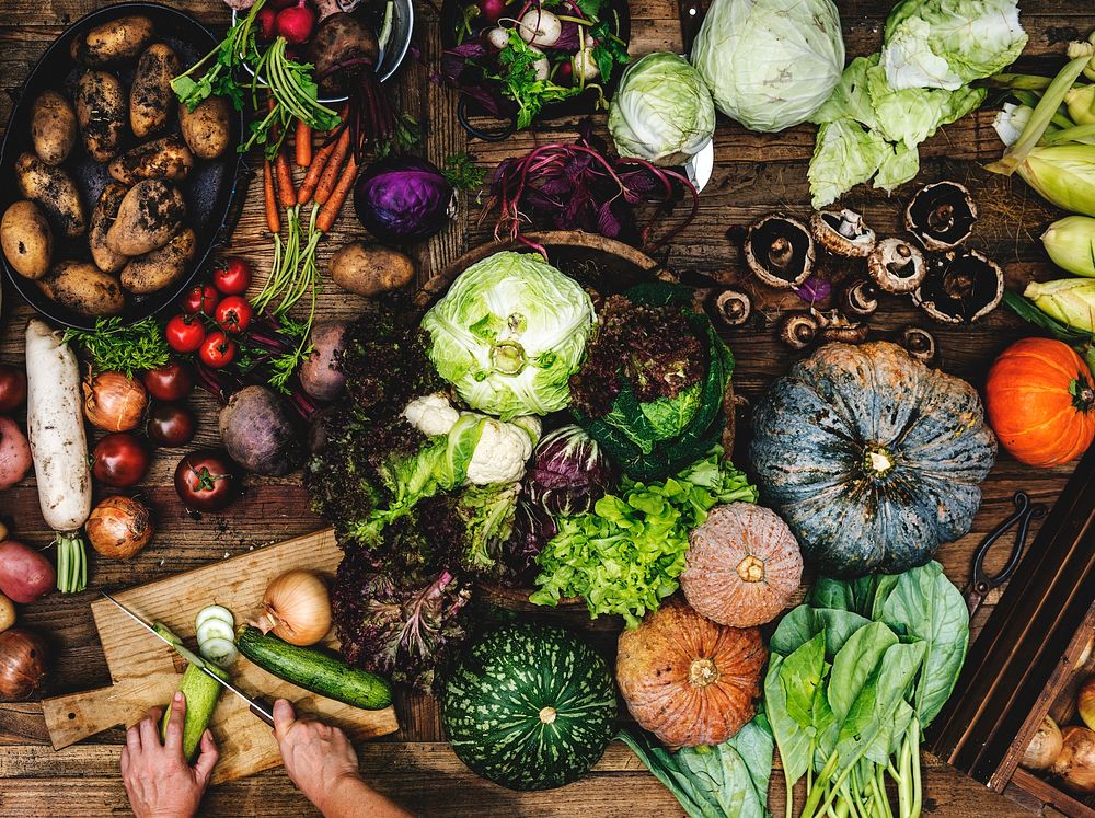 Aerial view of various fresh organic vegetable on wooden table