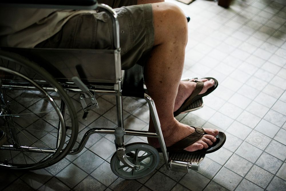 Side view of handicap senior man on wheelchair