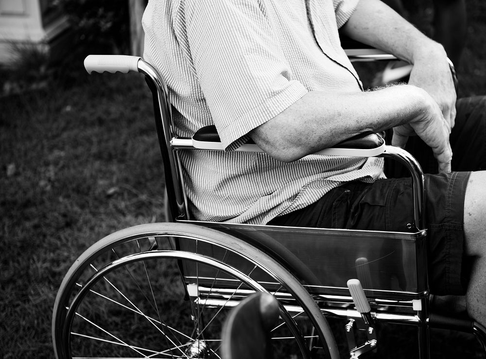 Closeup side view of handicap senior man at the yard
