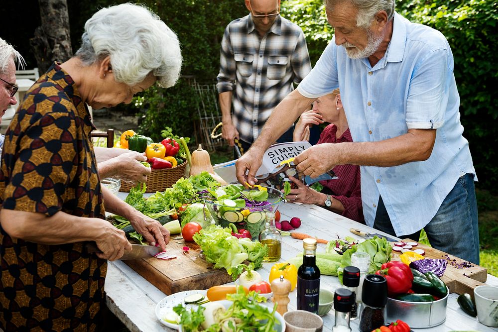 People prepare a vegetable for salad