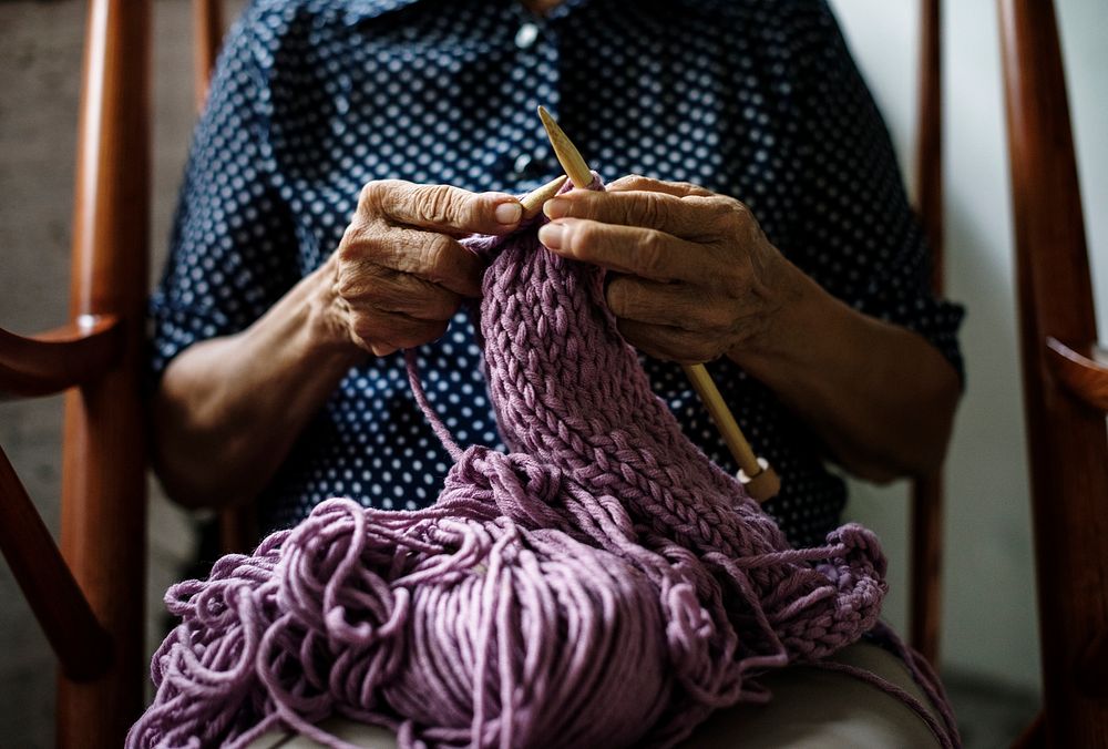 Closeup of senior caucasian woman knitting handicraft hobby