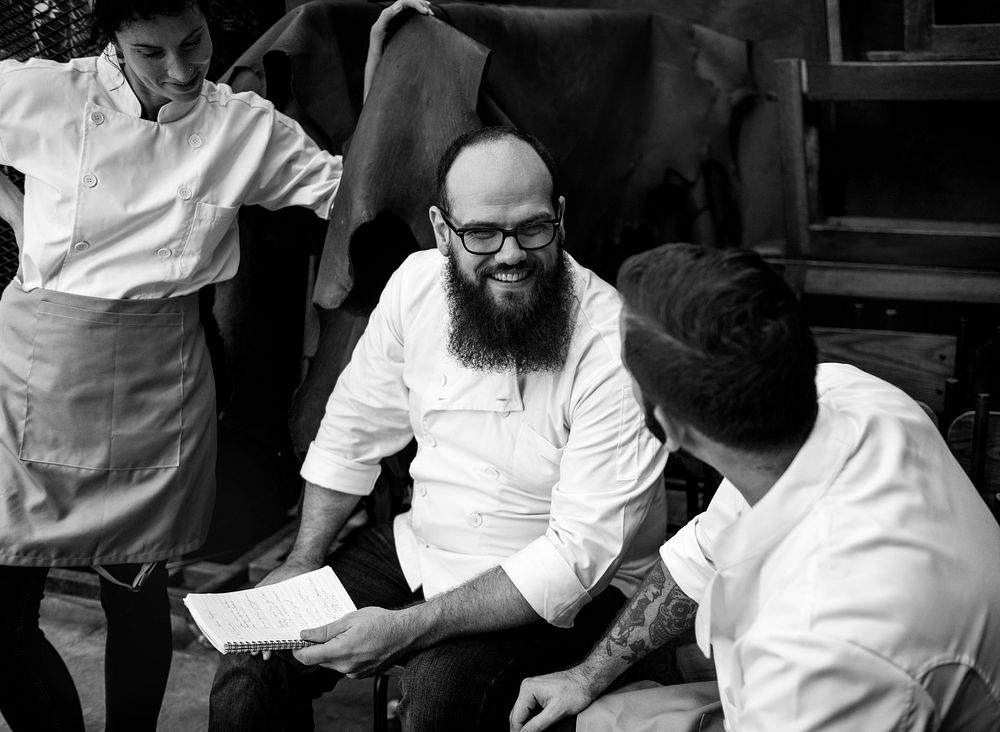 Group of chef talking together after work