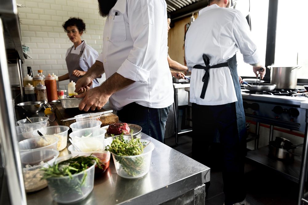 Group of chefs working in the kitchen | Premium Photo - rawpixel