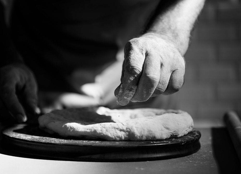 Closeup of hands making dough for bake