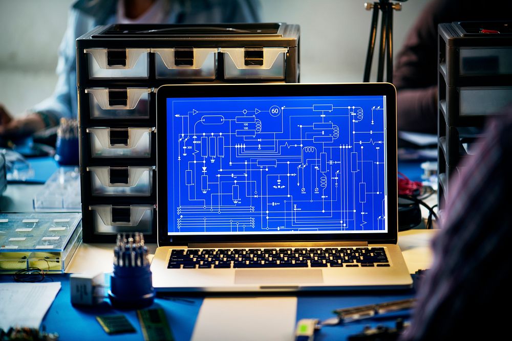 Computer laptop showing electronic circuit pattern