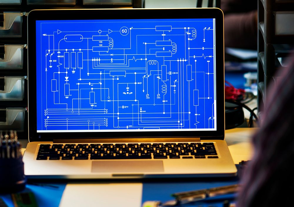 Computer laptop showing electronic circuit pattern