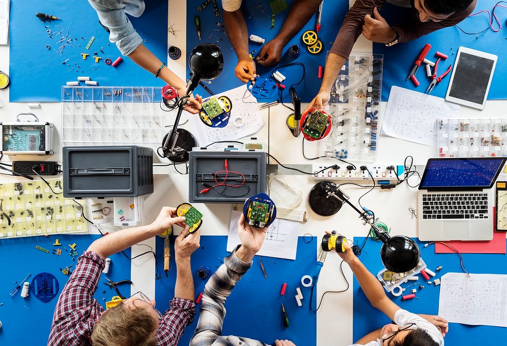 Technician team working at electronics repair shop