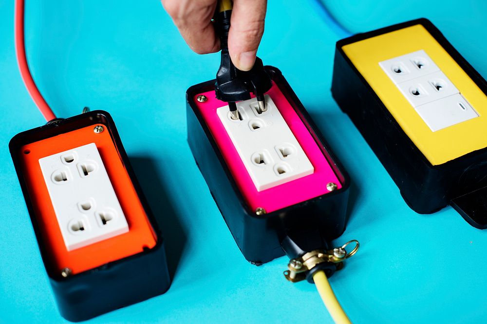 Electrical power supply plugs on blue background