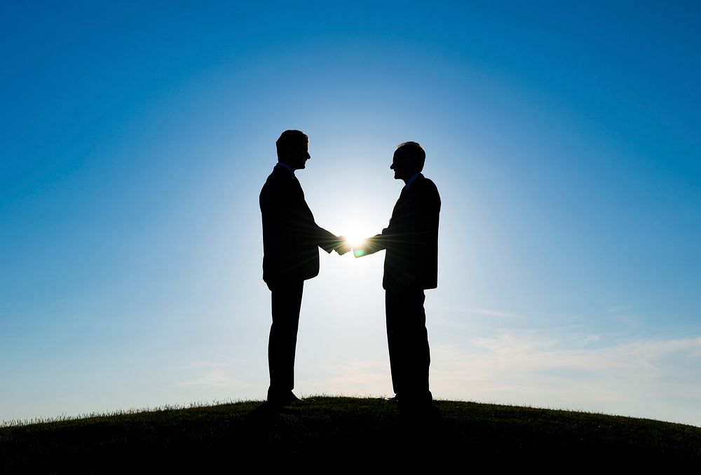 Two Businessmen handshaked for agreement