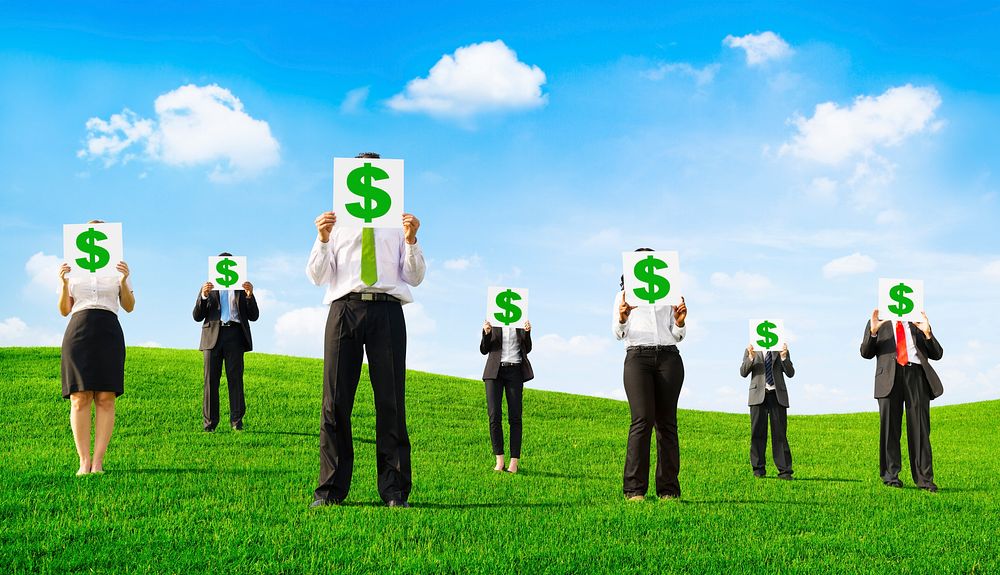 Business People Holding Placards with Dollar Signs Outdoors