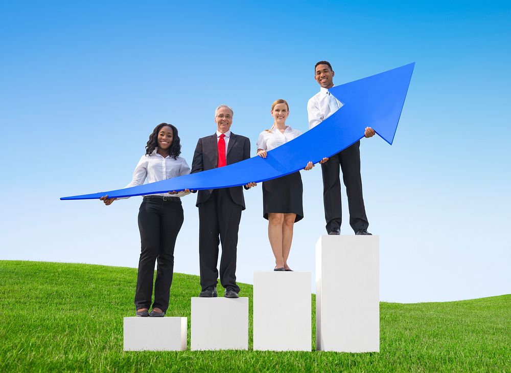 Business People Outdoors Holding Arrows that Shows Progress