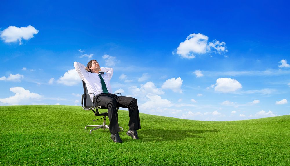 businessman relaxing on the field