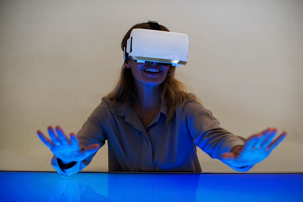 Woman using virtual reality gadget for entertainment