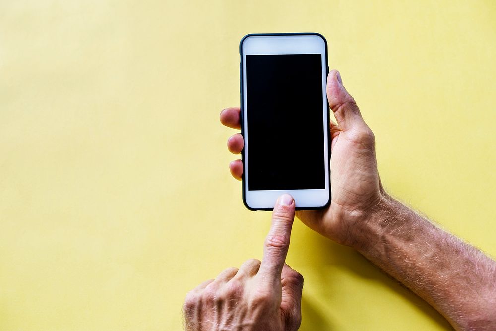 Hands holding smartphone isolated on a background