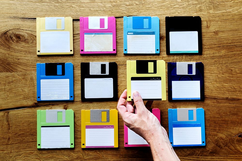 Hand holding floppy disk drive data storage