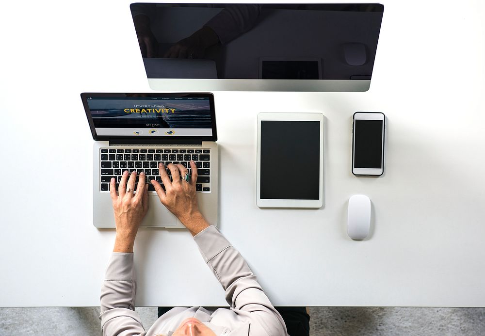 People working at the table with digital device