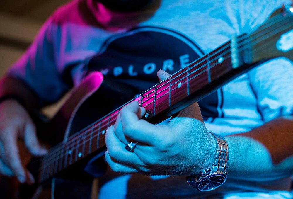 Man playing guitar in an event