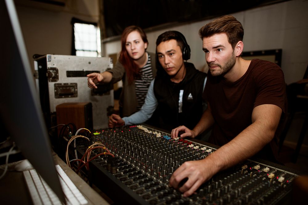 Sound engineer team check a sound on mixer