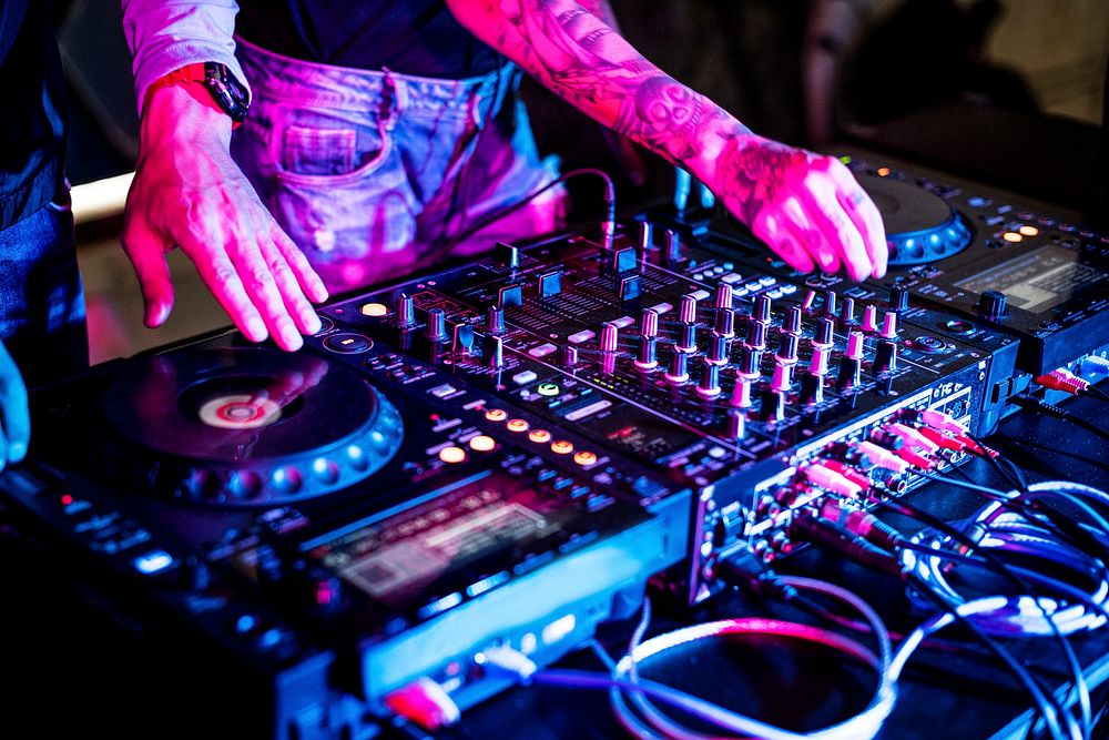 Hand on a sound mixer in a party