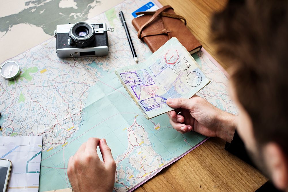 Young guy traveler planning the trip for vacation