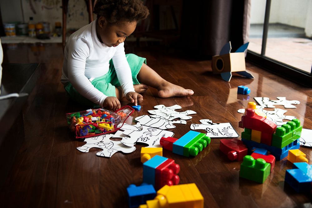 African descent kid enjoying puzzles