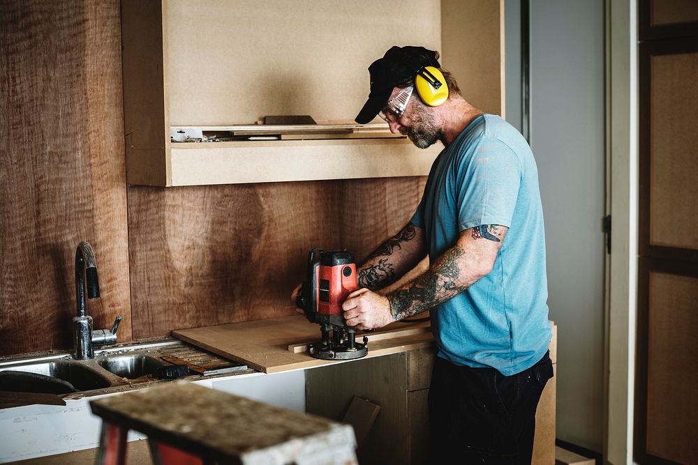 Carpenter woodworker working for house renovation