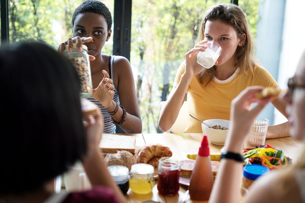 Group of diverse women having breakfast together